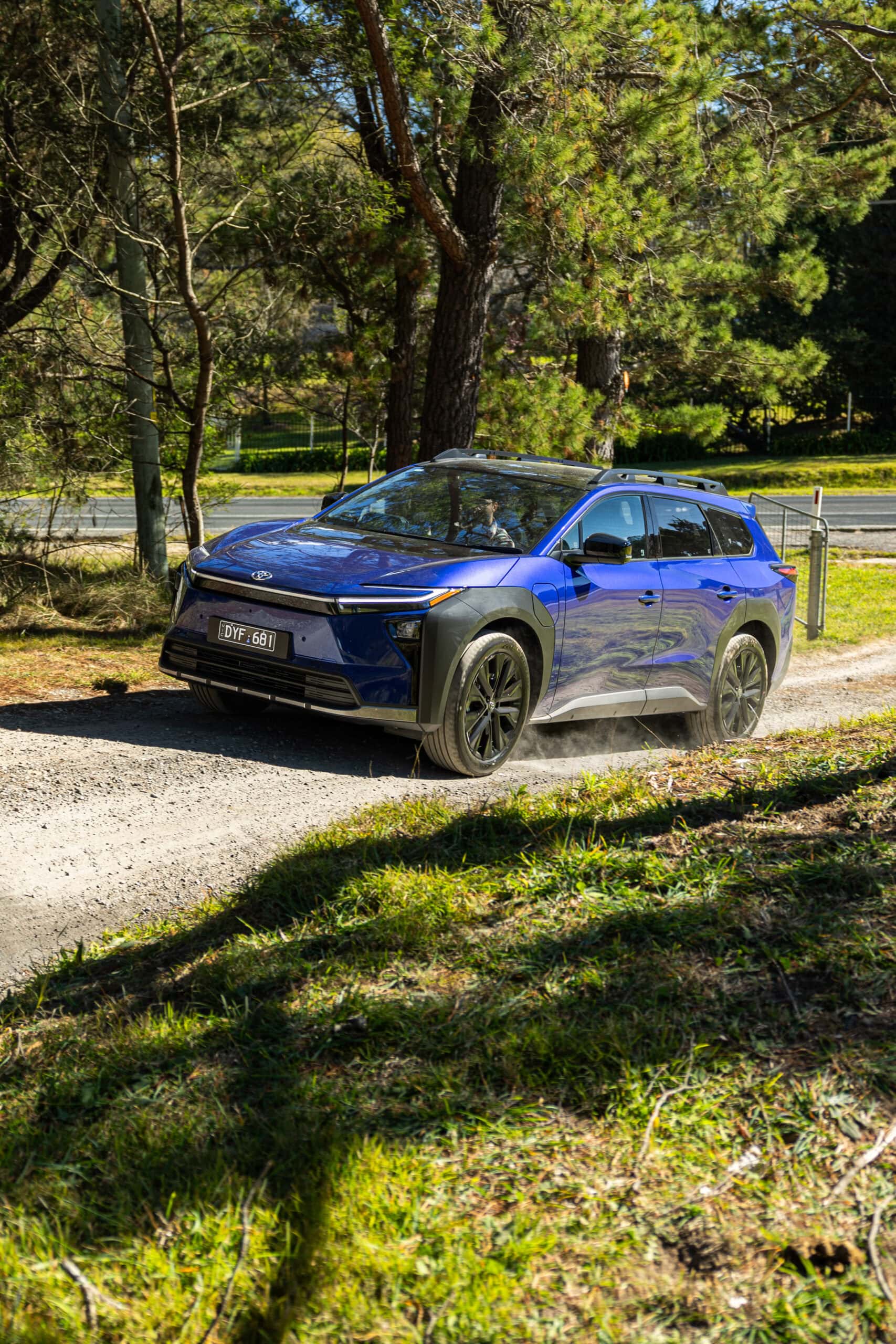Toyota bZ4X Touring driving on gravel road at Three Blue Ducks Burradoo NSW
