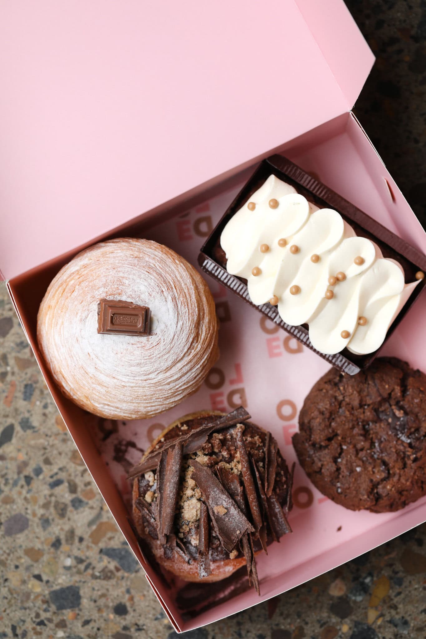 Whittaker's chocolate cruffin, tiramisu loaf and cookies in pink box at Lode Surry Hills Sydney