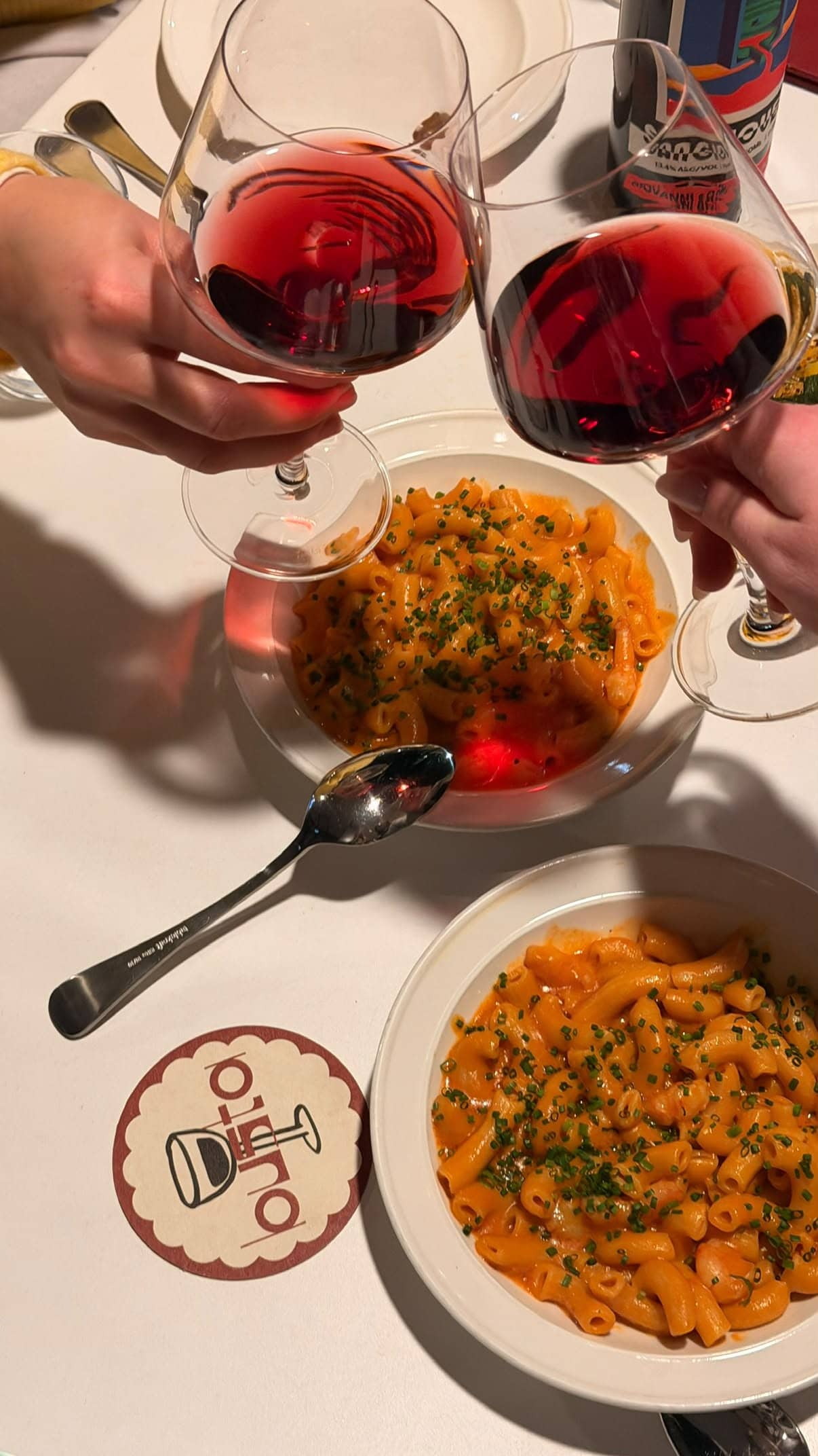 Rigatoni pasta dishes and red wine on table at Busta Manly Sydney