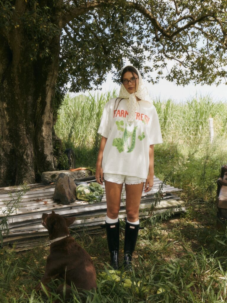 A model wearing a MAKU Studios t-shirt
