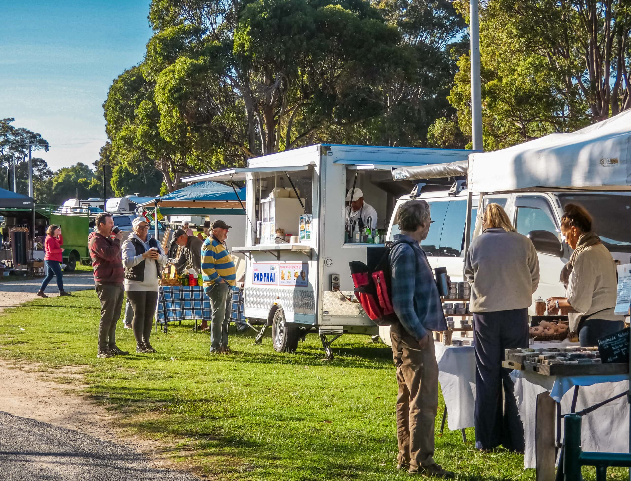 Visitors browse food stalls and food trucks at the Wild Harvest Seafood Festival