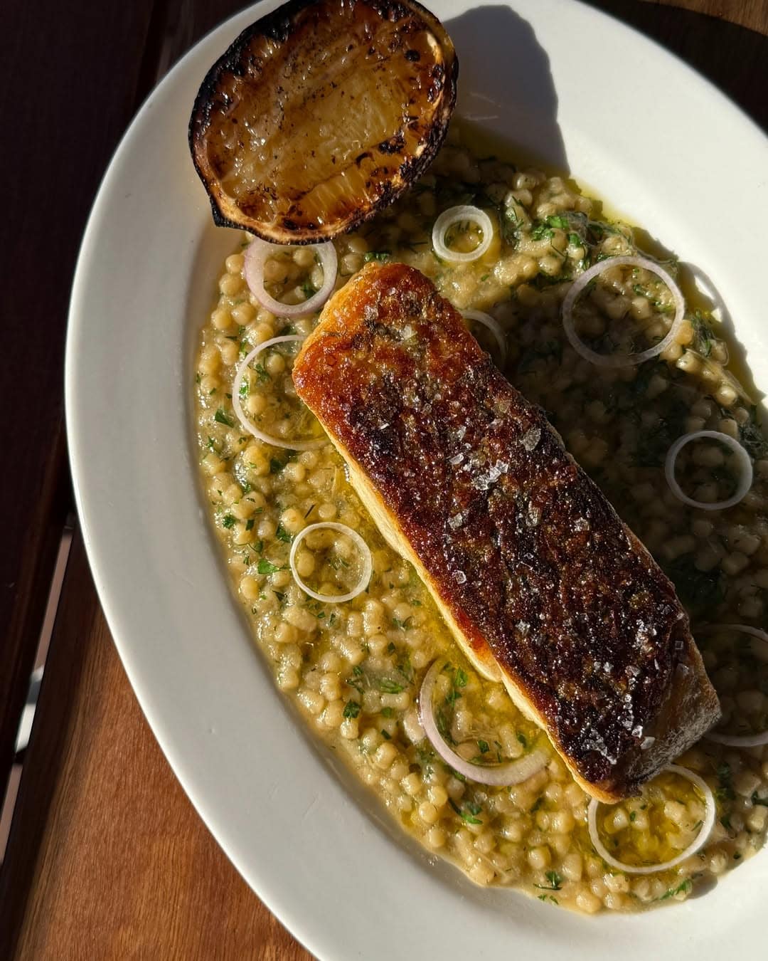 A plate of barramundi atop cous cous at Fior in Gymea.