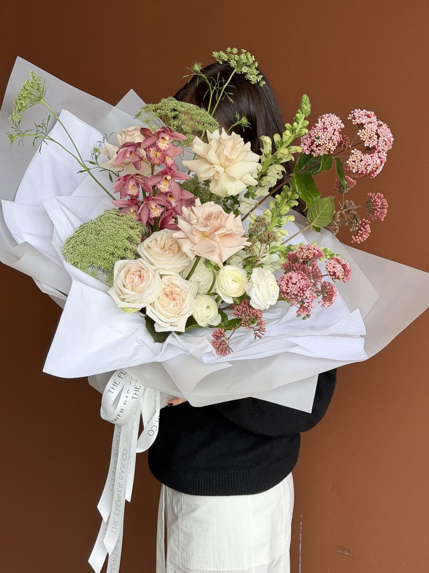 A big bouquet of dusy rose and white flowers at The Flower Bar Co.