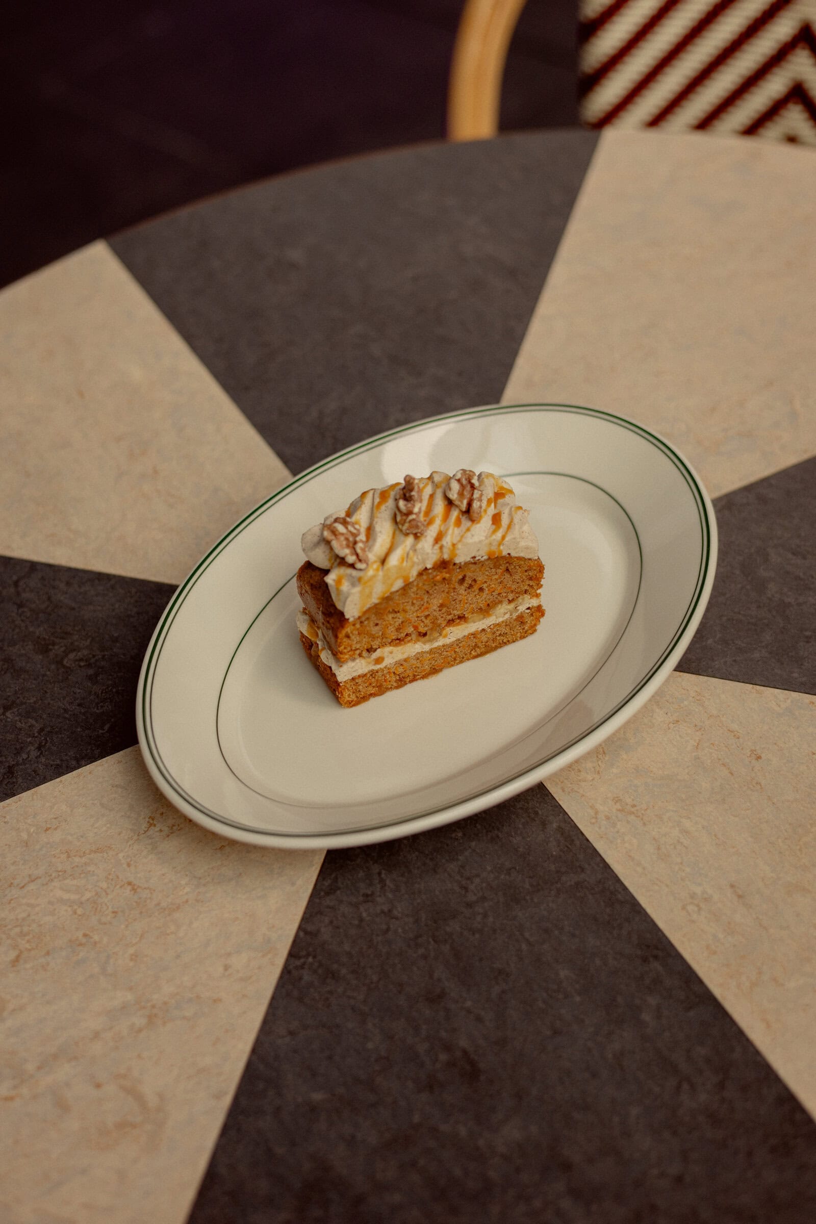 Slice of carrot cake with spiced cream, walnuts and caramel drizzle at Bruno's, Finger Wharf Woolloomooloo Sydney