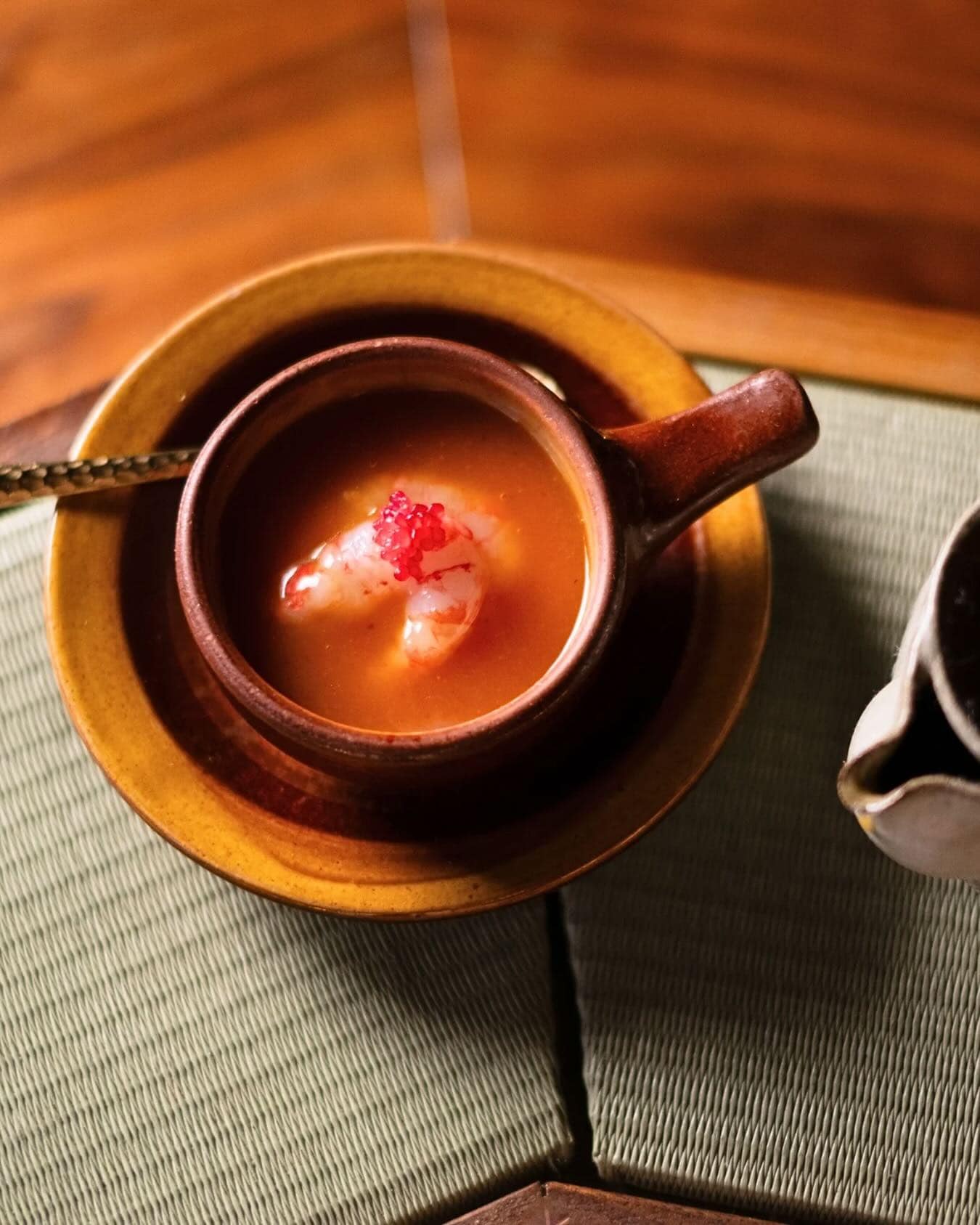 A bowl of Japanese chawanmushi topped with a raw prawn at Haco in Sydney.