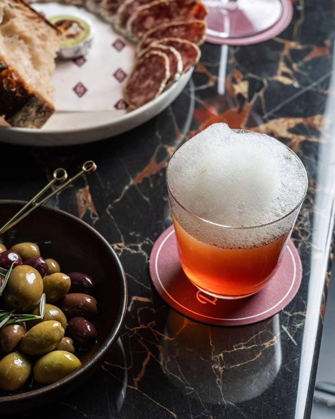 A foam topped cocktail at Dean & Nancy on 22 in the CBD.