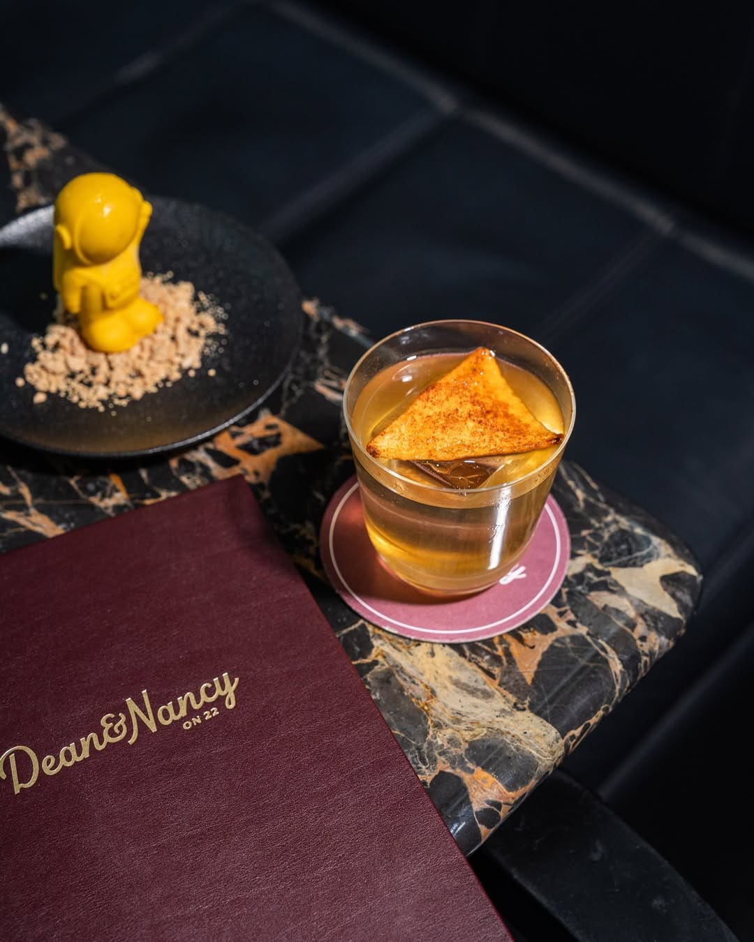 A cocktail atop a marble table at Dean & Nancy on 22 in Sydney.
