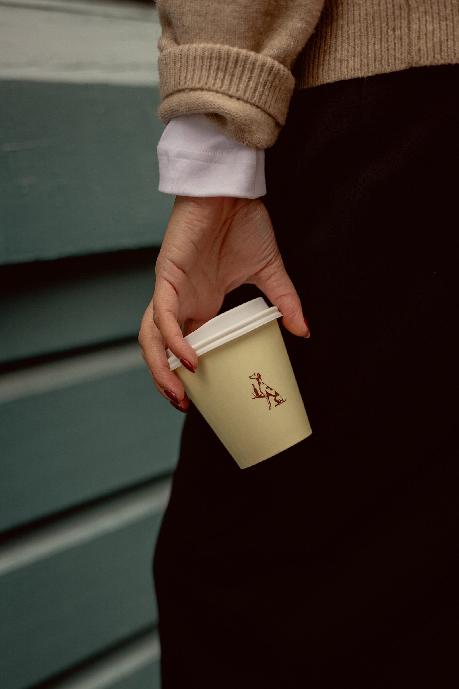 Takeaway coffee in a Bruno's cup with its dog logo, Finger Wharf Woolloomooloo Sydney
