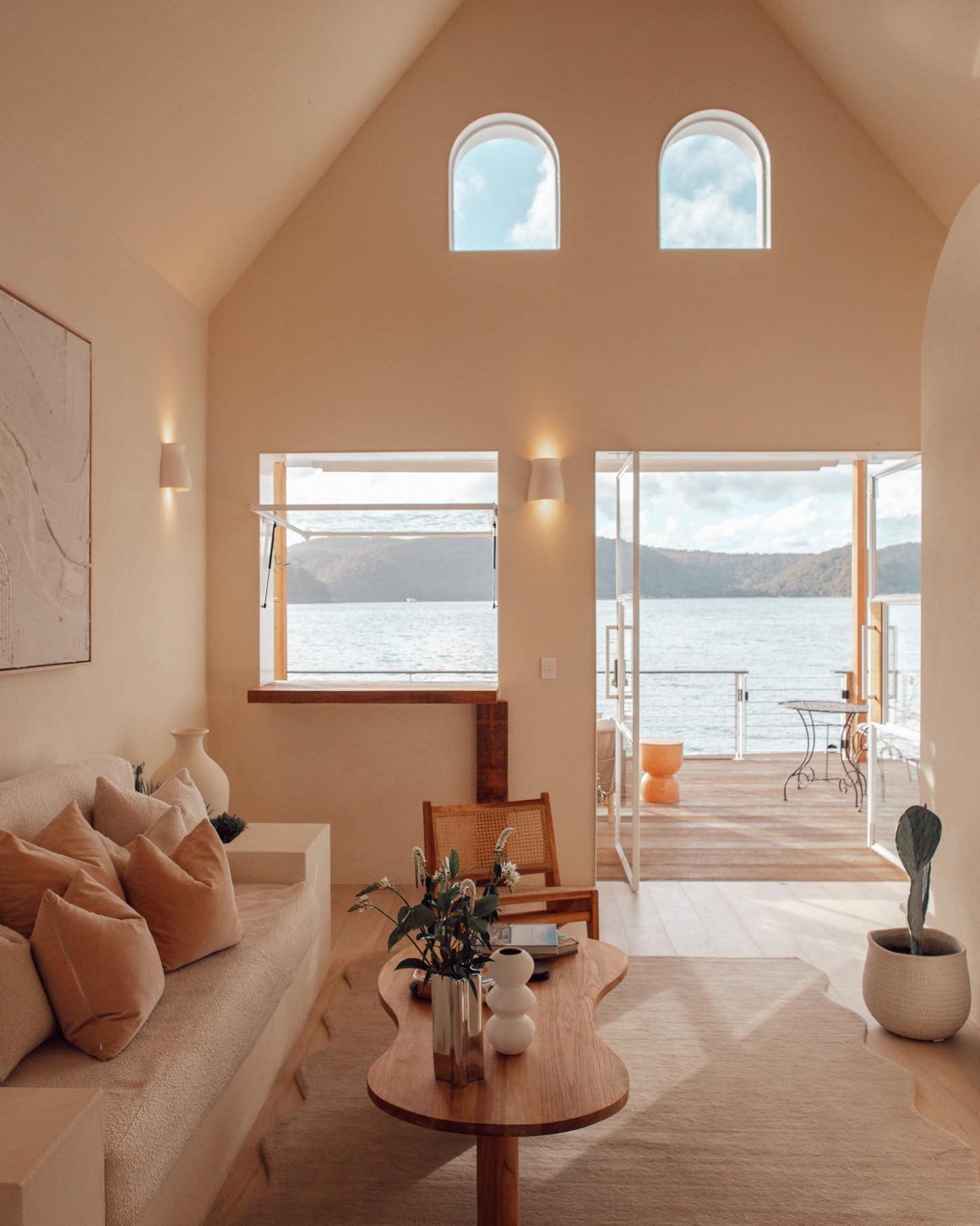 Living area with water views at Lilypad floating villa Palm Beach Sydney