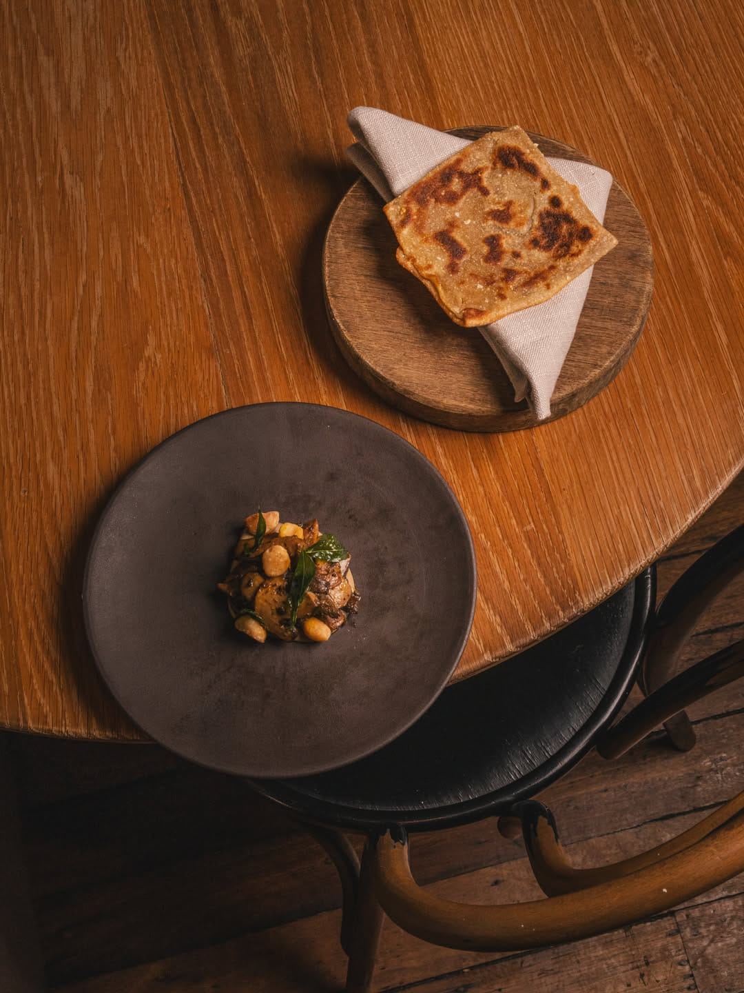 A plate of mushrooms and bread at Yellow in Potts Point.