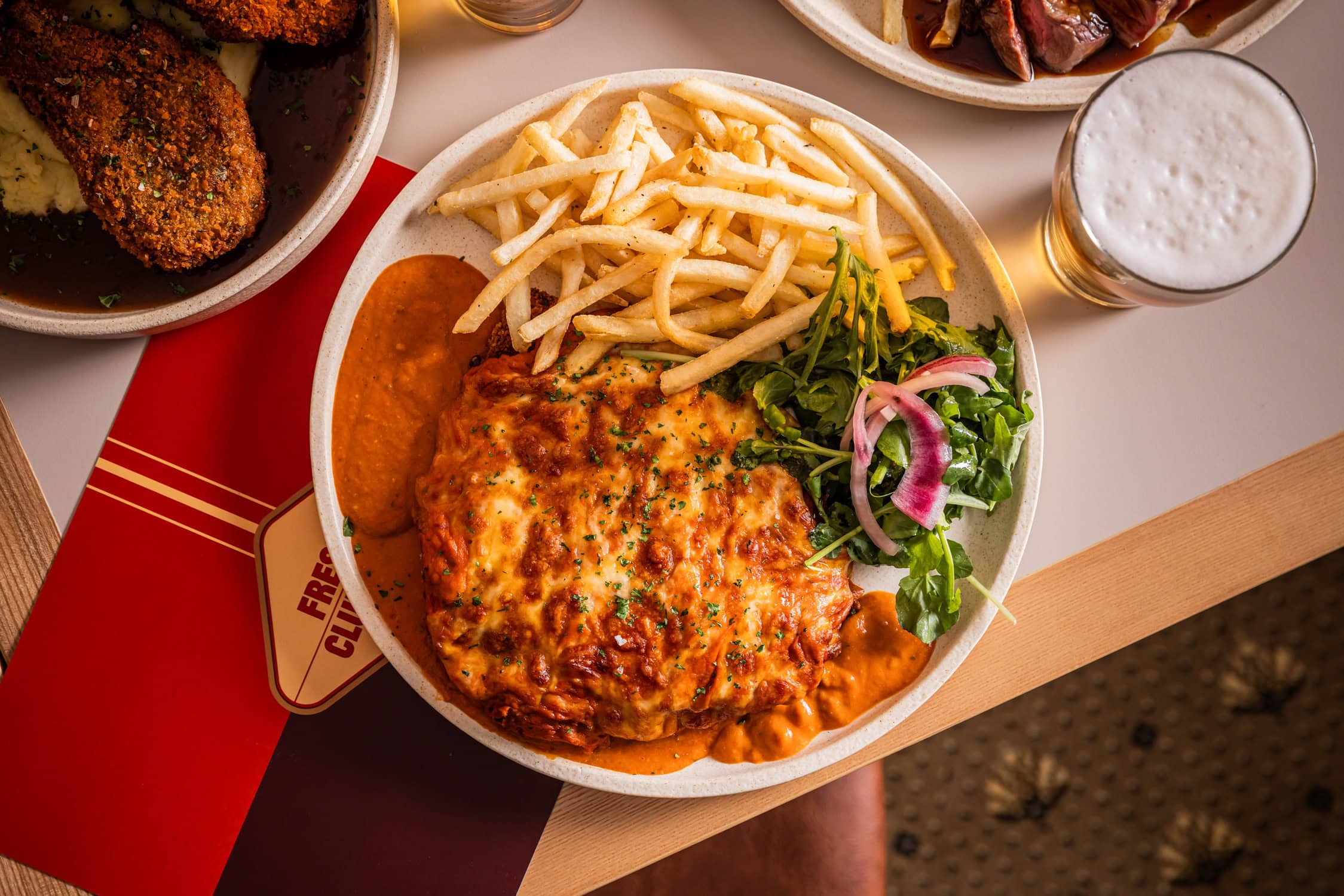 Parma alla vodka with chips and rocket salad at Freshie Clubhouse Brookvale Sydney