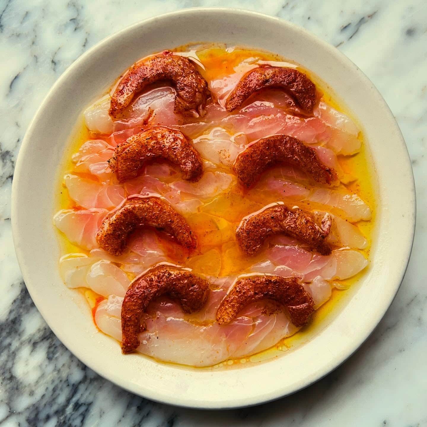 Raw coral trout topped with prawns at Ester in Chippendale.