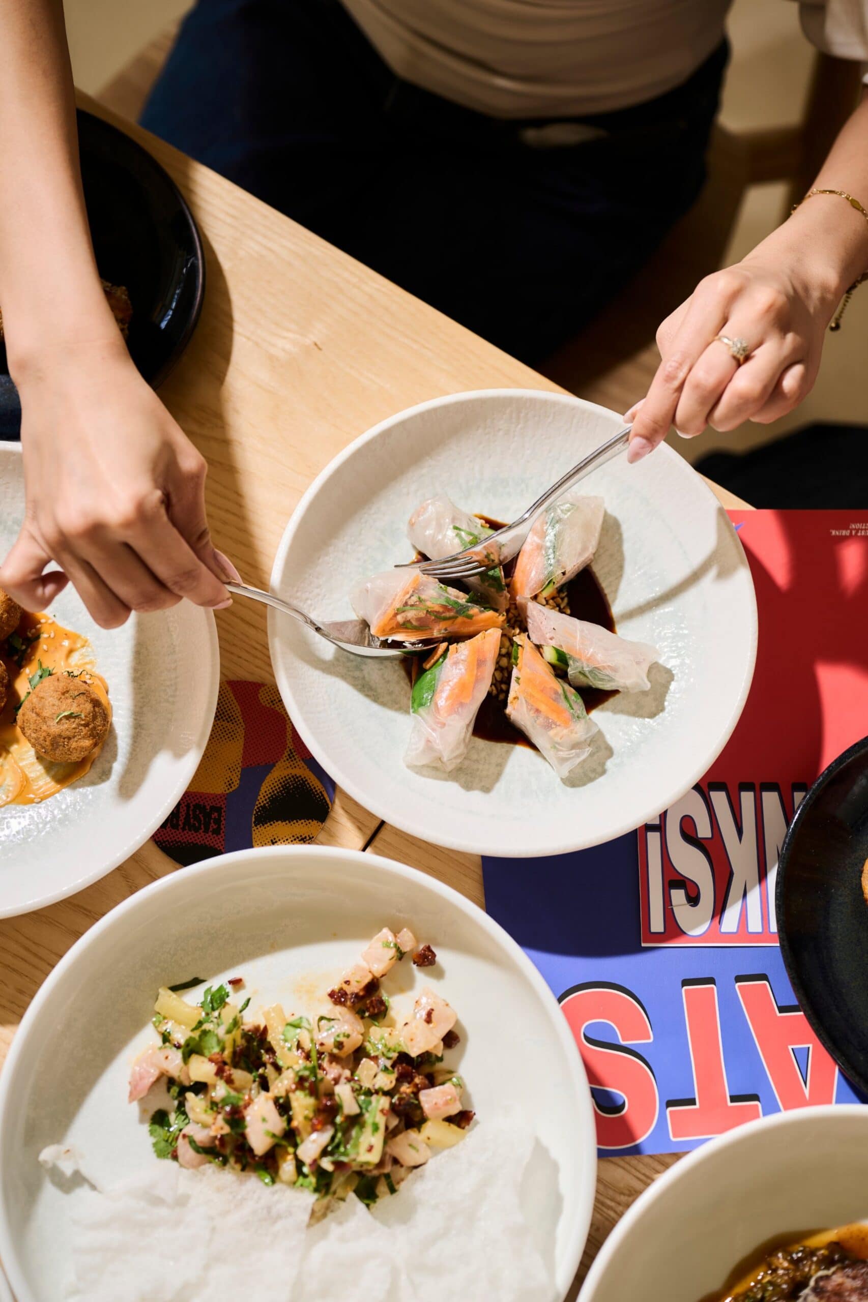 Rice paper rolls with dipping sauce and a raw fish salad on rice crackers shared at EASY BOY!, Scullin Canberra