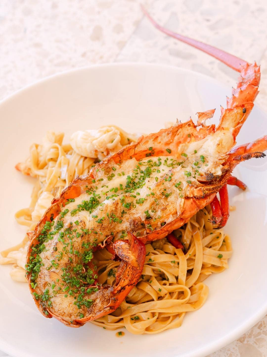 A rock lobster atop pasta at Bobbys in Cronulla.