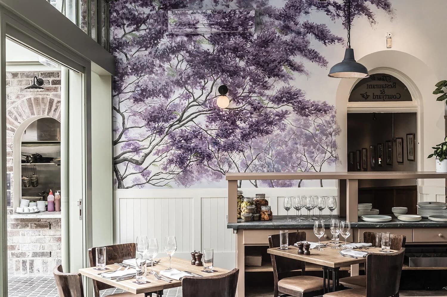 Purple jacaranda mural in the dining room at Stables Bar and Grill, The Glebe Hotel, Glebe, Sydney