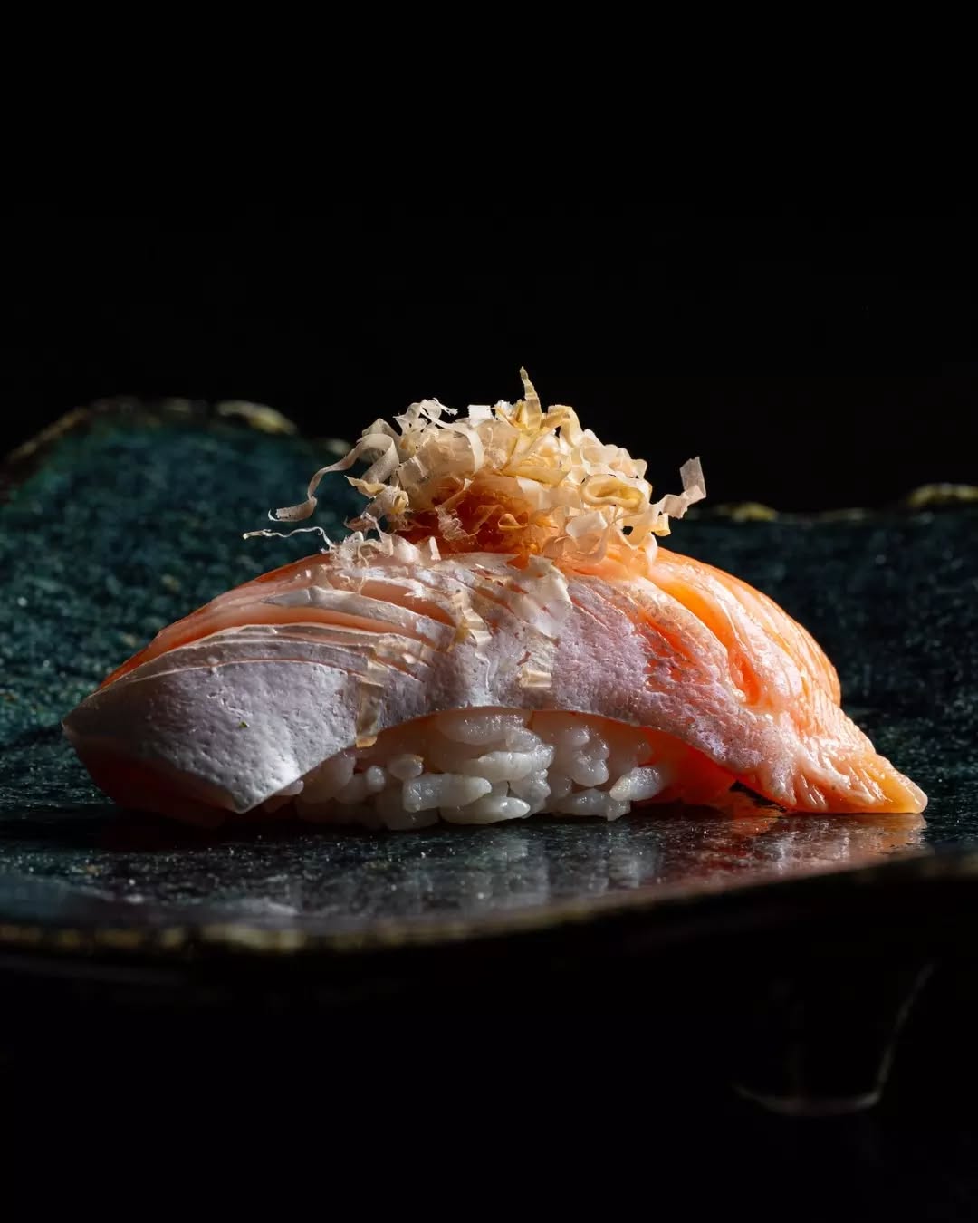 A single piece of plated sushi at Ora omakase in Sydney.