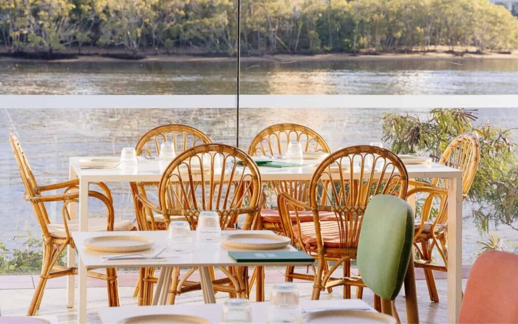 The floor to ceiling windows at Ciao Papi in Brisbane, showing waterfront views and the Story Bridge.