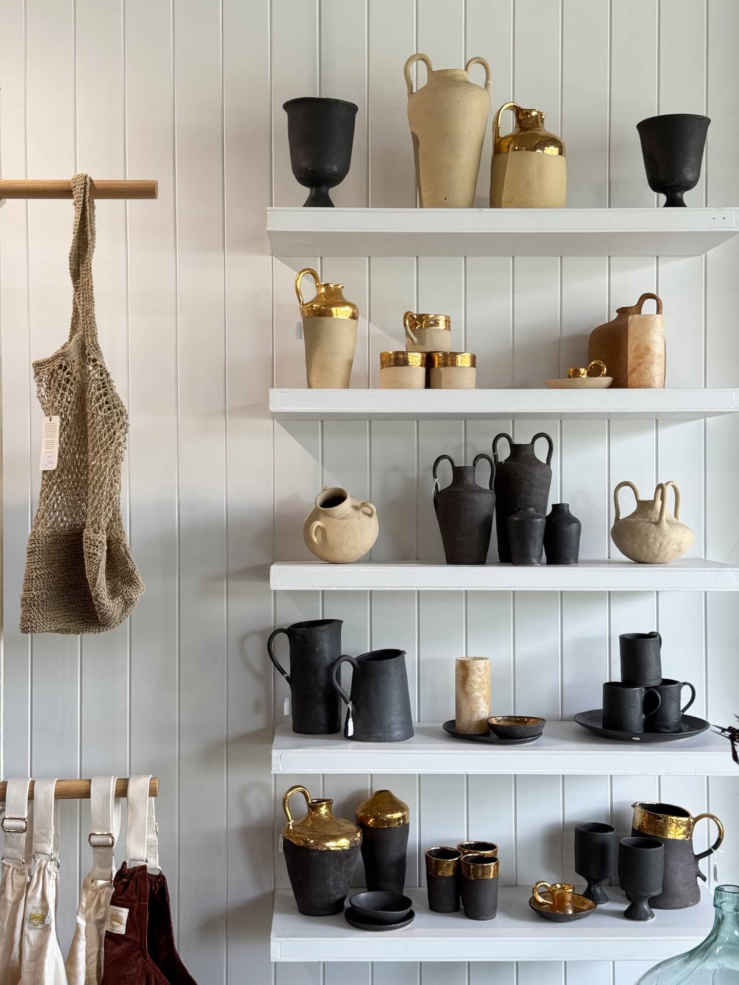 Shelves of vases at Habitat Collective in Byron Bay.