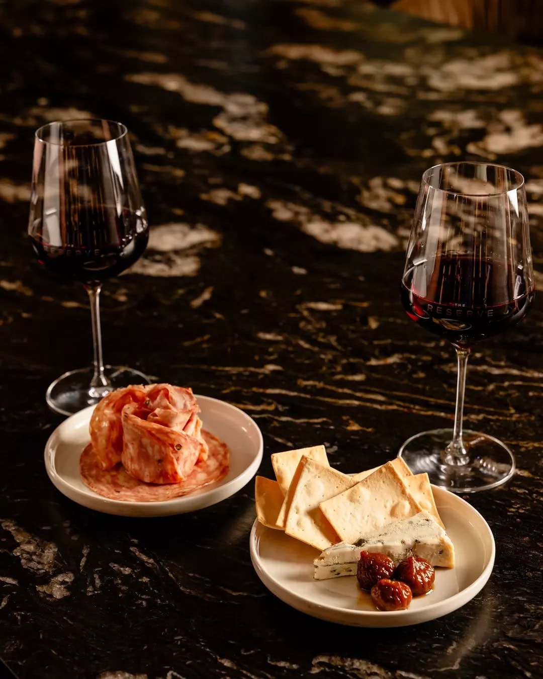 Two glasses of wine and snacks at The Reserve Wine Bar in Brisbane.