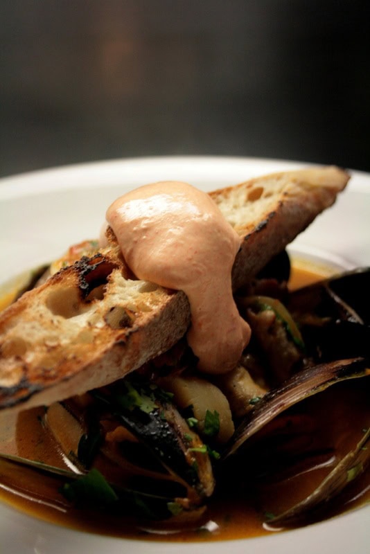 Provençal-style seafood dish with mussels, toasted bread and creamy sauce at Bistrot d’Orsay in Melbourne CBD.