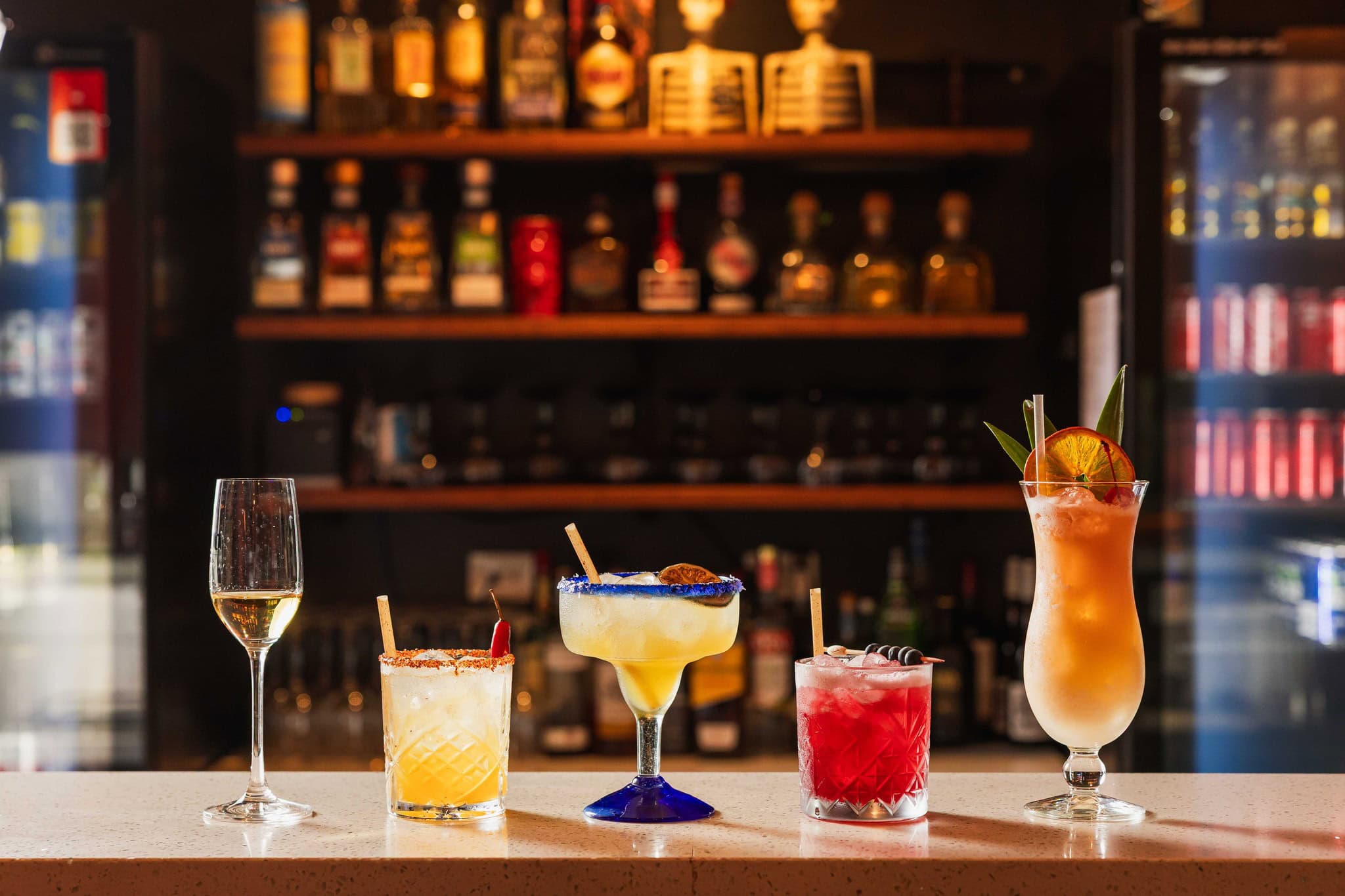 A line up of five drinks on a bar at Pepe's North Brisbane.