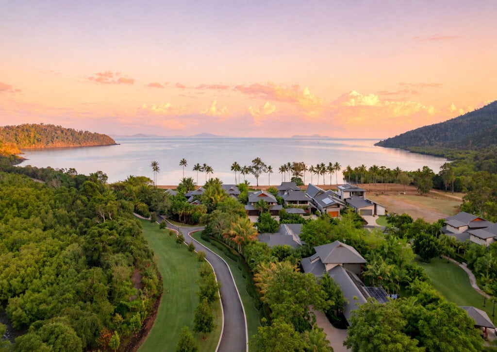 Aerial view of Yangaro’s villas and tropical grounds beside Funnel Bay at sunset in the Whitsundays. Credit Rose Grace Studios4