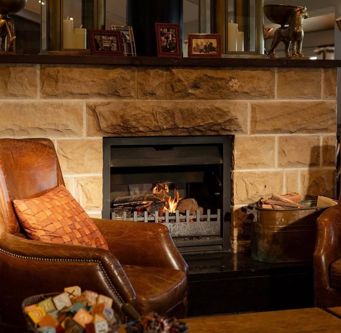 Cosy fireplace and leather armchairs inside Donovans, the iconic beachfront restaurant in St Kilda, Melbourne.