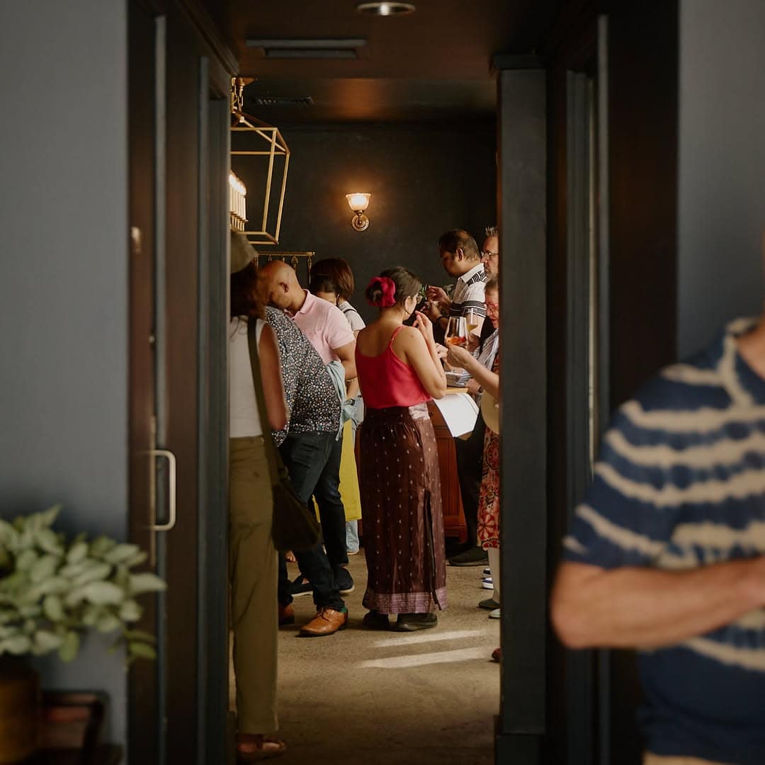 Guests gathering inside Enter Via Laundry in Melbourne, an intimate fine dining restaurant known for contemporary Indian cuisine.