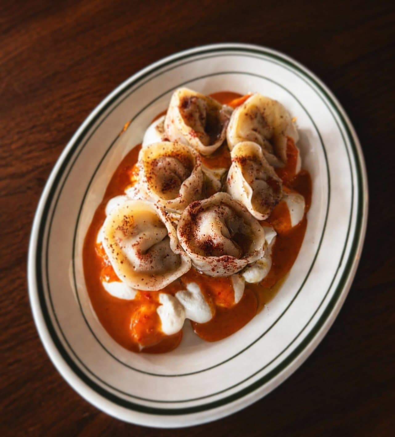 Hand folded dumplings served on garlic yoghurt and burnt butter.