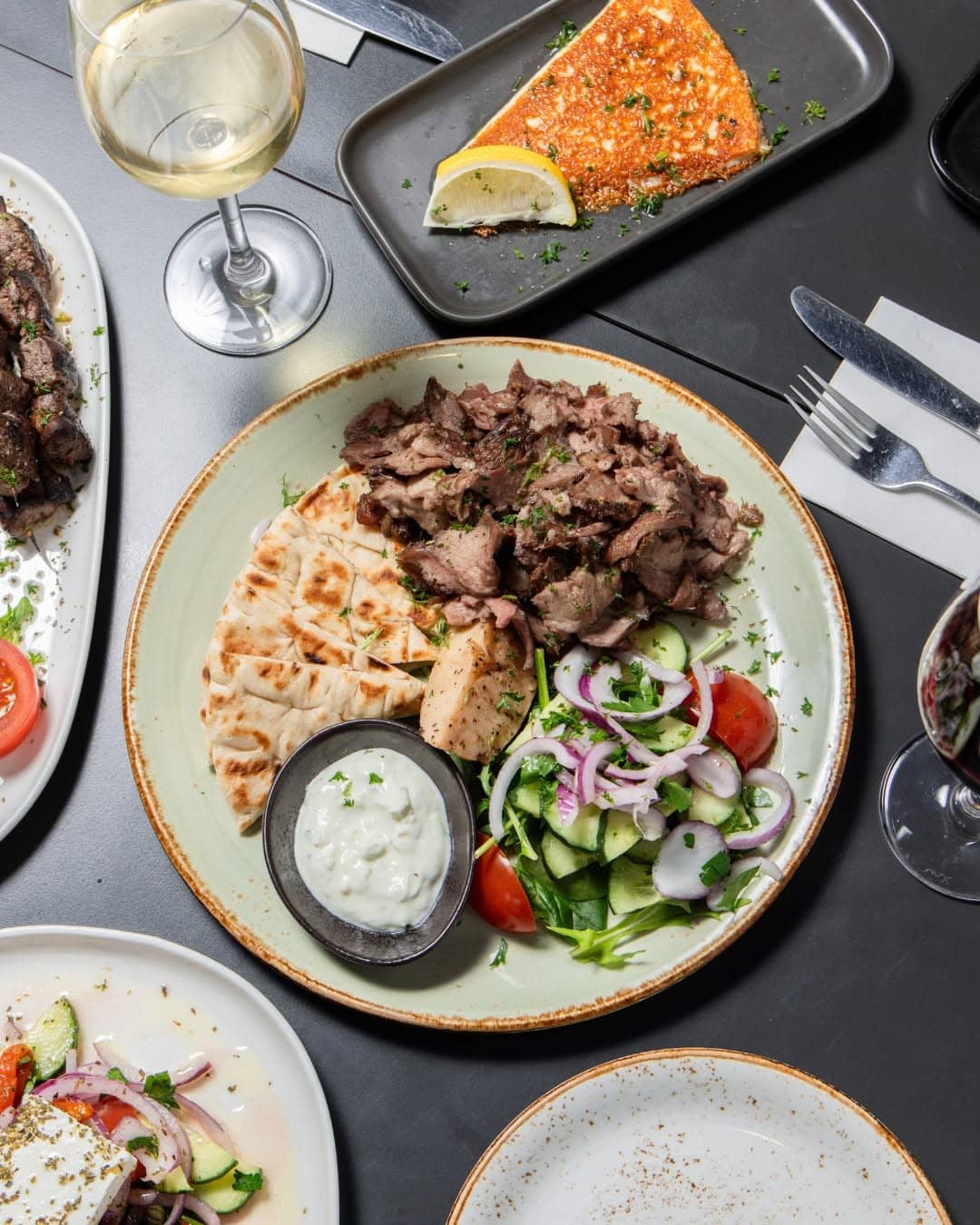 Greek lamb with pita, tzatziki and village salad served at Mavs Greek Restaurant in Geelong.
