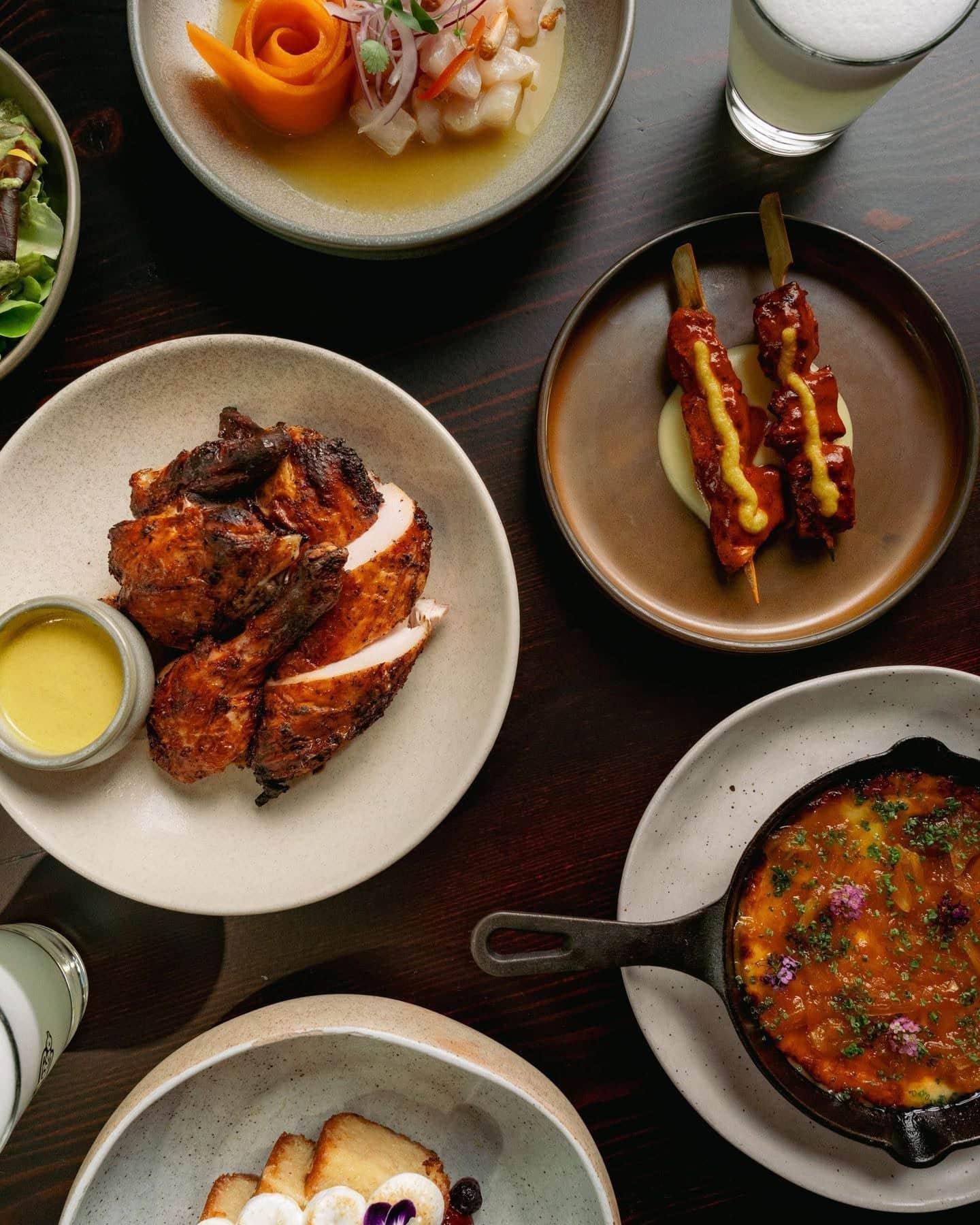 Peruvian sharing plates including roasted chicken, anticucho skewers and ceviche at Pastuso in Melbourne CBD.