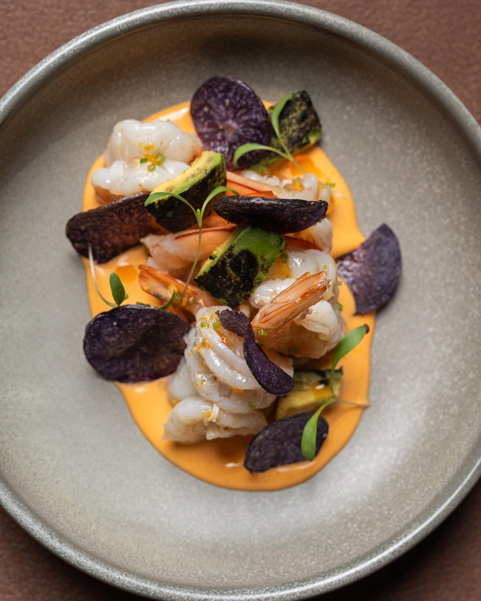 Prawns with avocado, purple potato crisps and creamy sauce at Pastuso, a Peruvian restaurant in Melbourne.