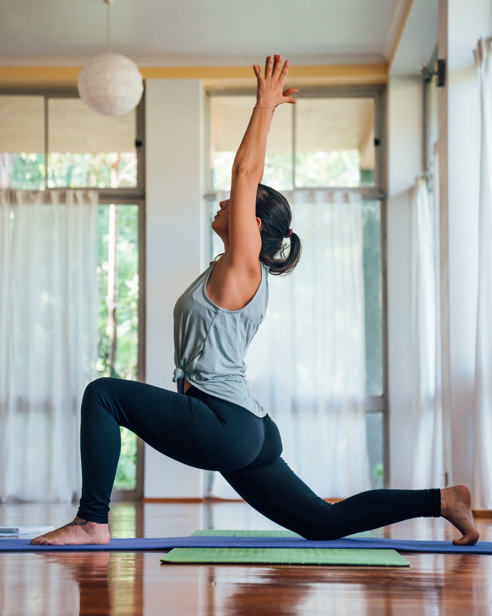 A woman holding a pose on a mat at Heart & Soul Retreat in Otford.