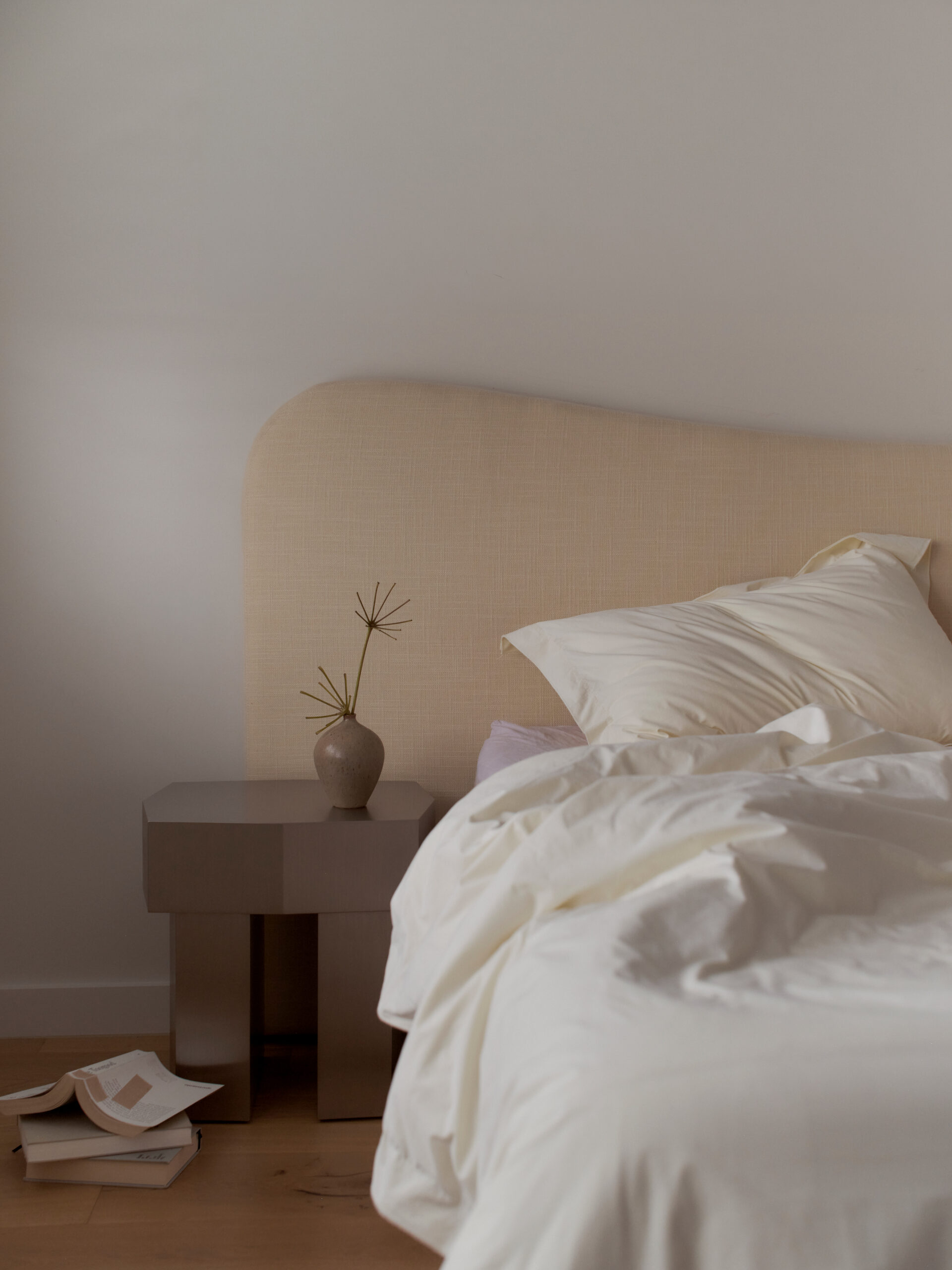 Bedroom interior with upholstered bedhead at McMullin & Co