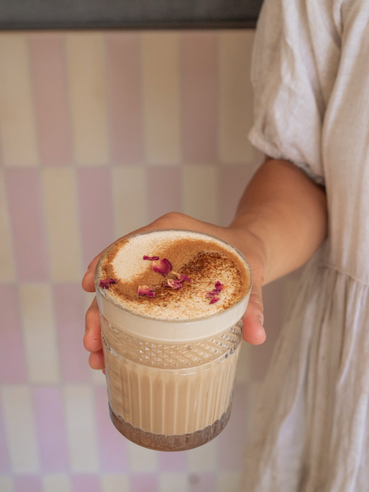 Someone holding a cup of chai at Combi in Byron Bay.