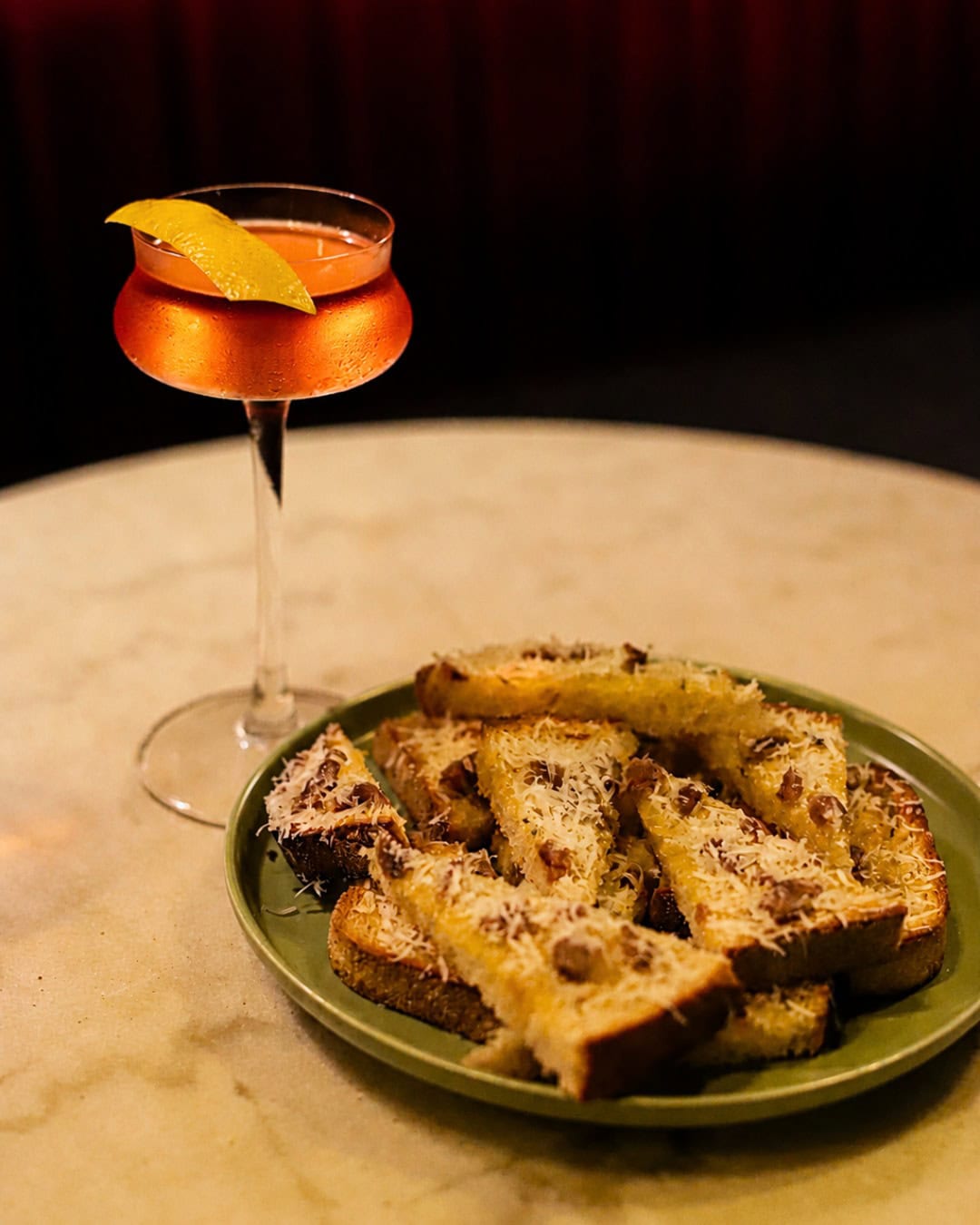 A plate of fried bread and a cocktail at Devil You Don't in Canberra.