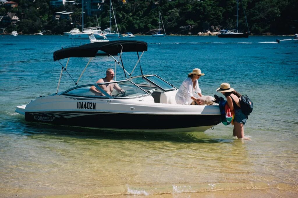 Dog and owners boarding a boat at Spit Reserve, Mosman, Sydney