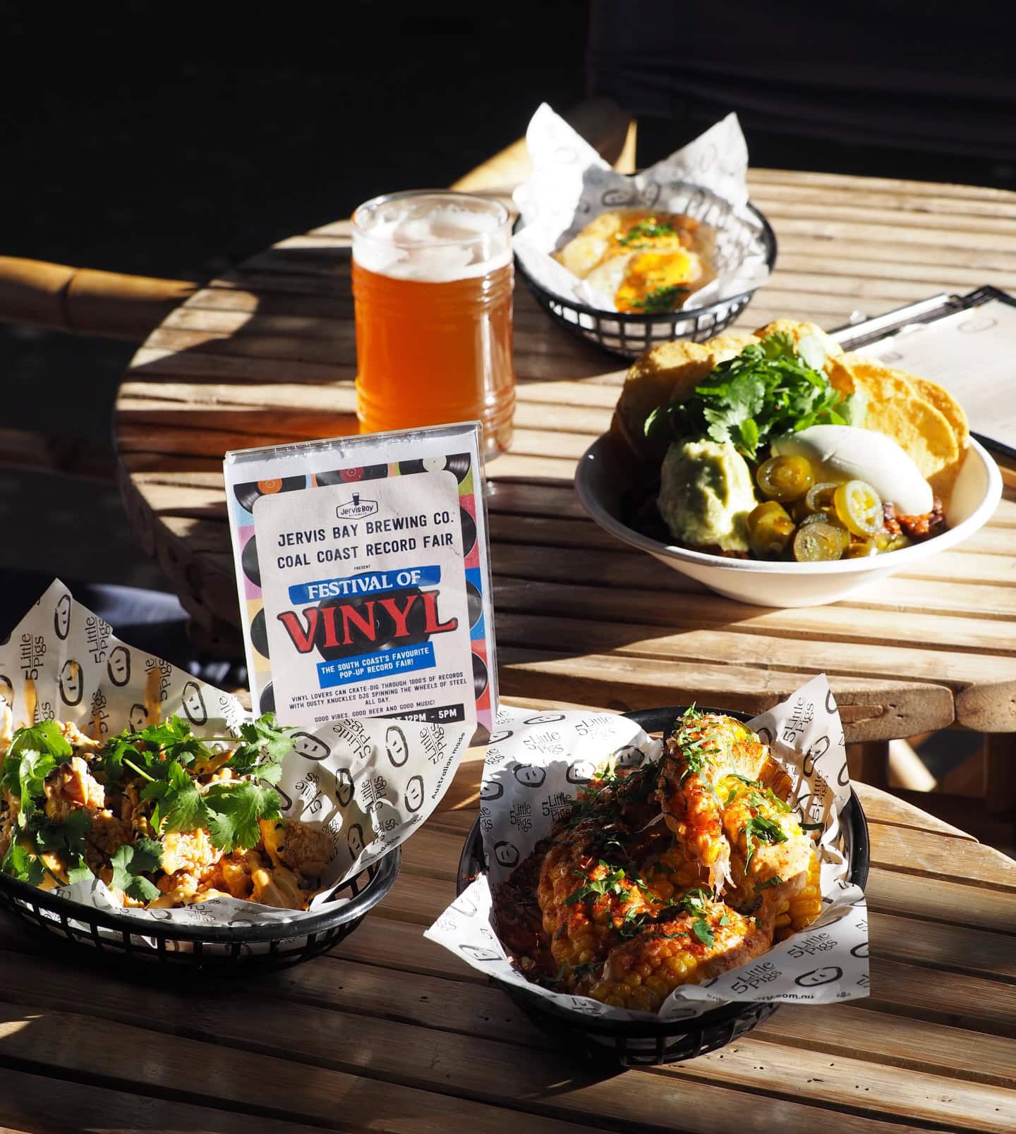 A spread of food in plastic baskets from the 5 Little Pigs food truck at Jervis Bay Brewing Co in Hukisson.