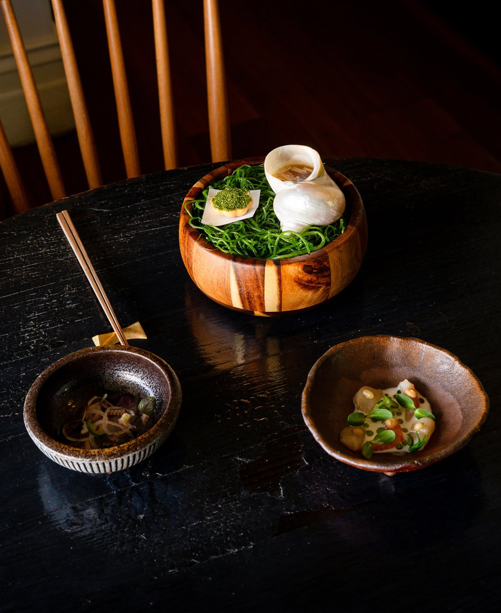 Artfully plated Japanese tasting menu courses at Kadota in Daylesford, including seafood served in shell-inspired presentation.