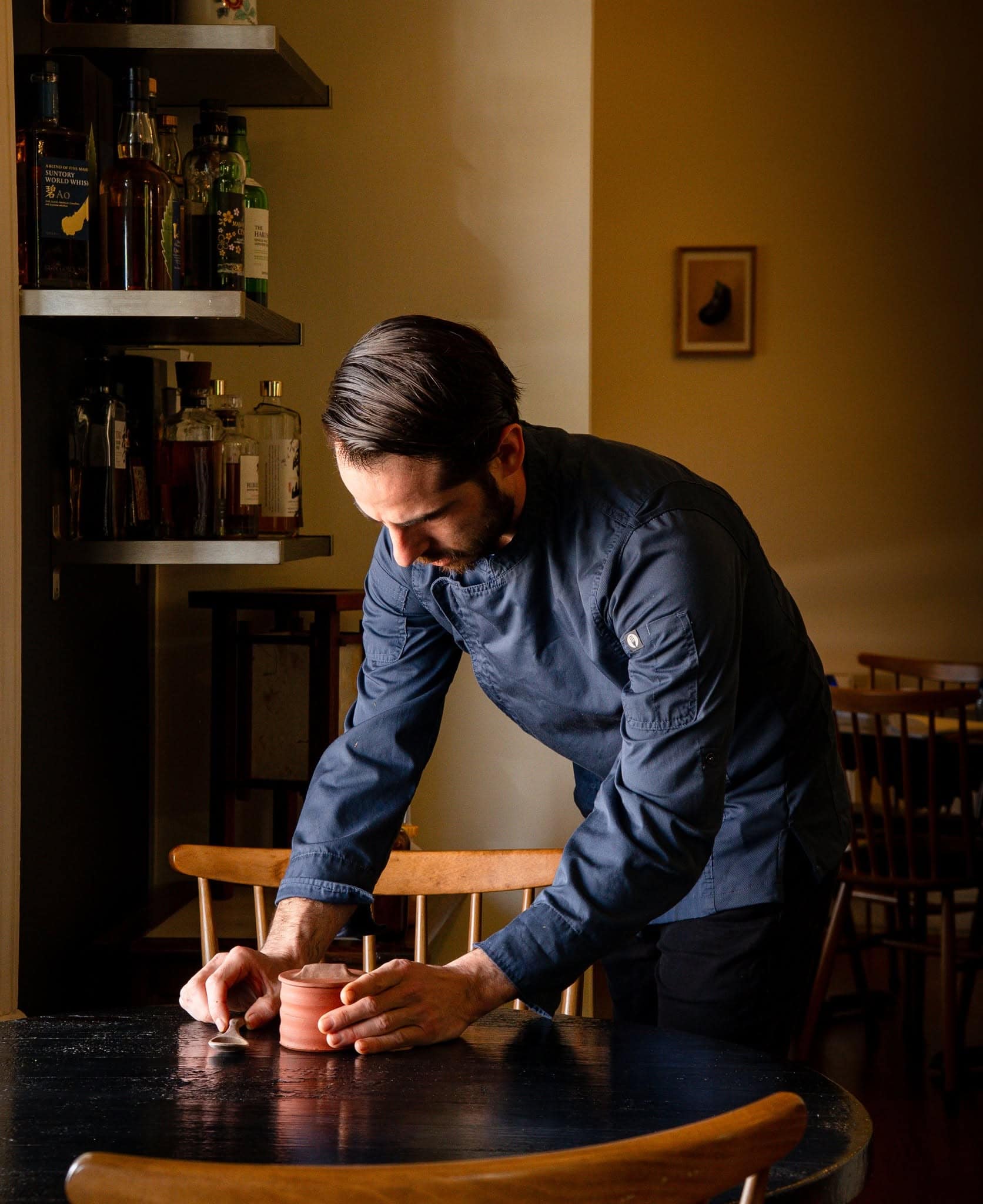 Chef plating a course inside Kadota, the intimate Japanese-inspired fine dining restaurant in Daylesford, Victoria.
