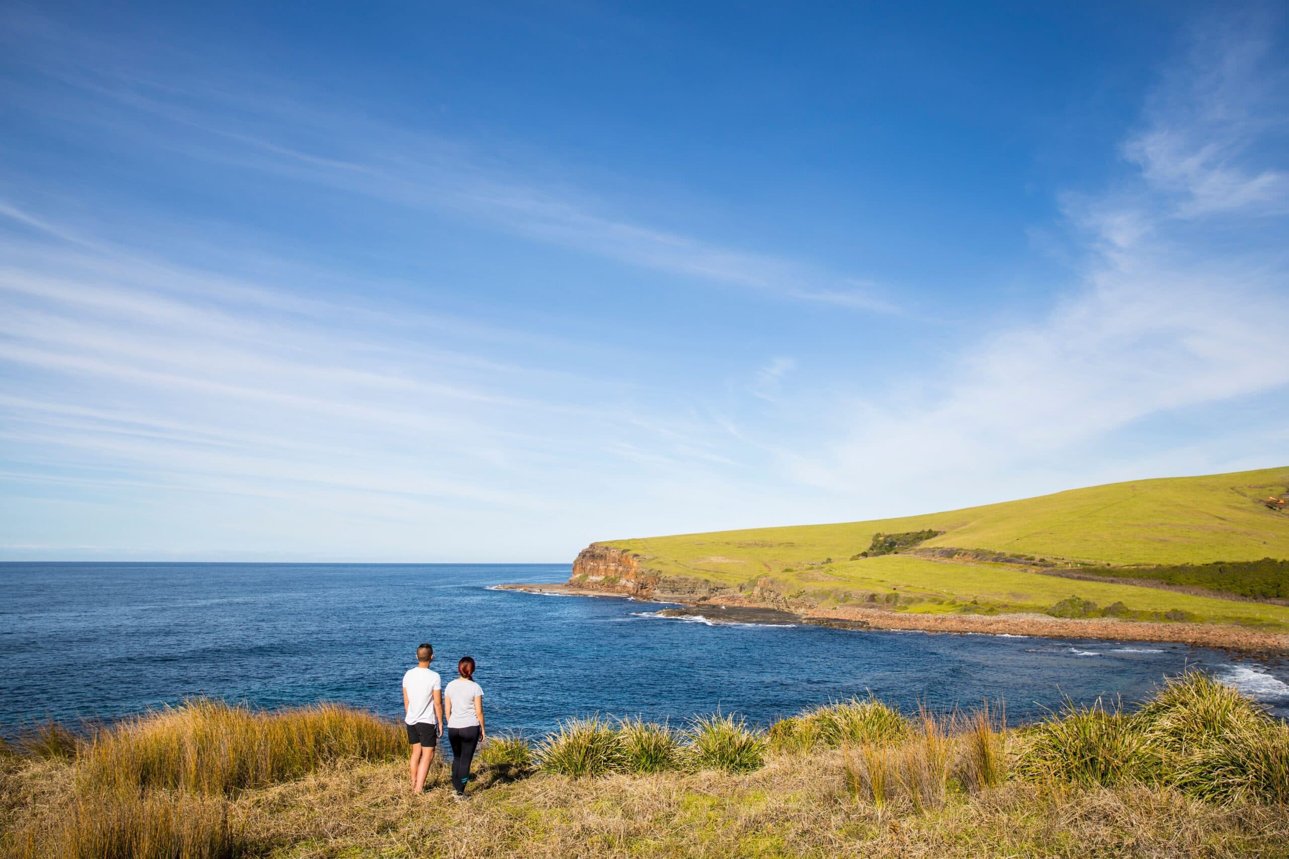 Couple enjoying a walk along the Kiama Coastal Walk on the South Coast.