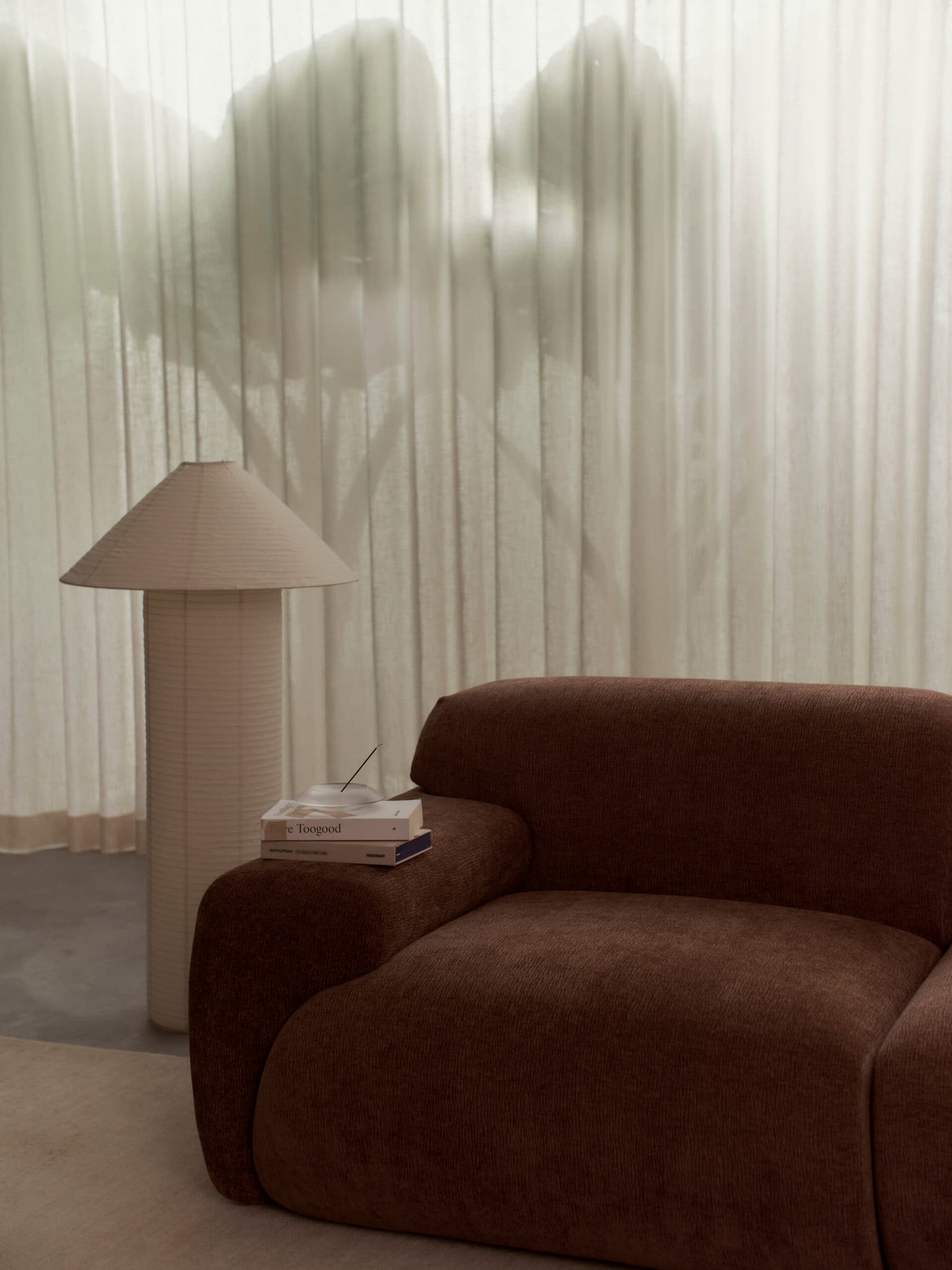 Living area with sofa and floor lamp at McMullin & Co