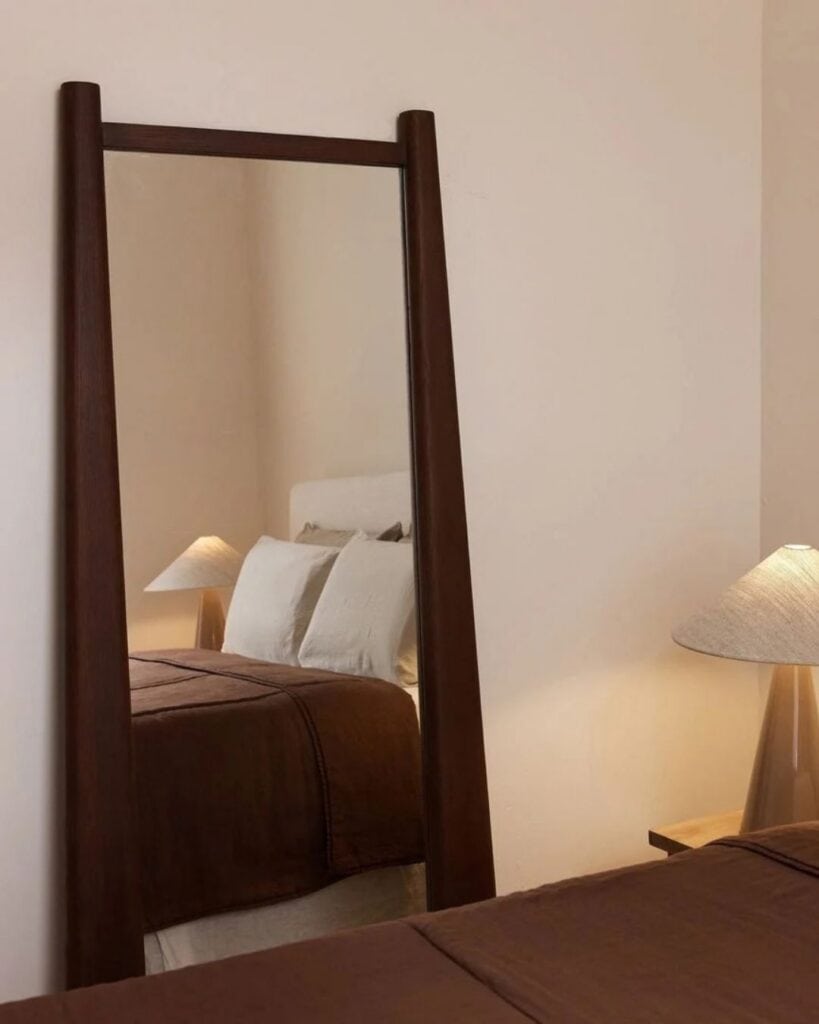 Brown floor mirror from mcmullin with tapered edges