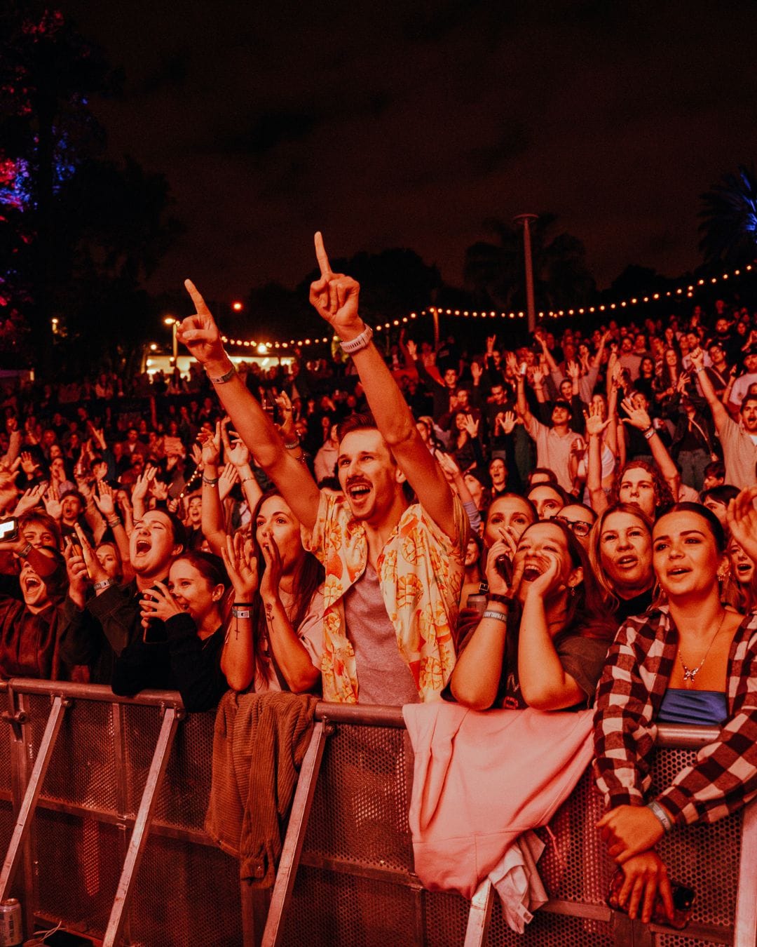 The crowd enjoying live music at Night At The Parkland in Brisbane.
