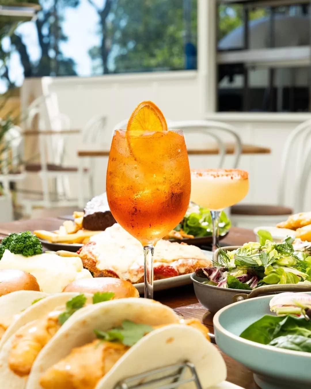 A spread of tacos and Aperol at Huskisson Hotel.