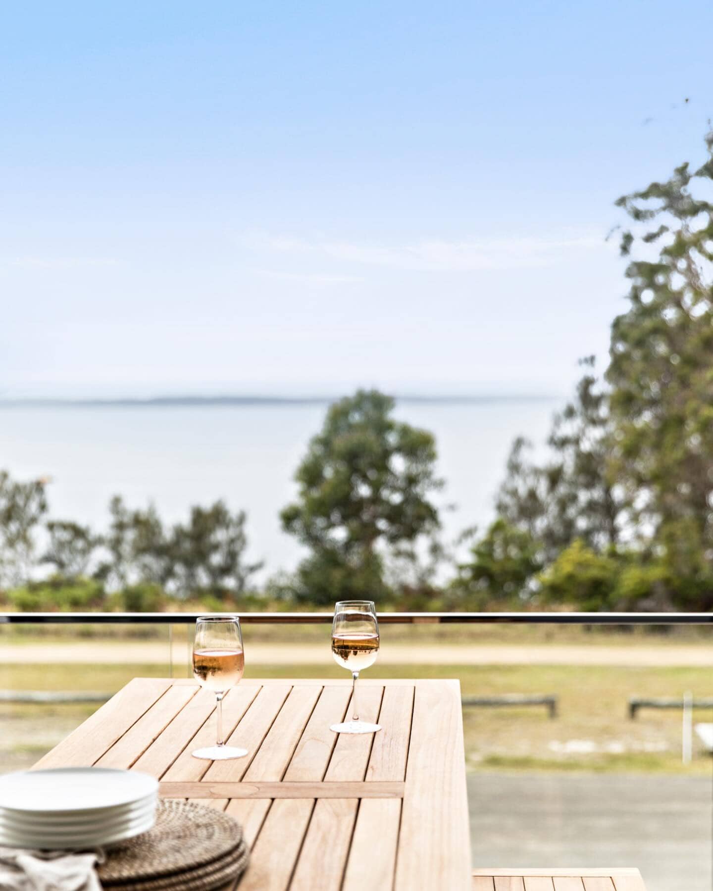 Two wines sitting on a balcony at Mandala Beach House in Jervis Bay.