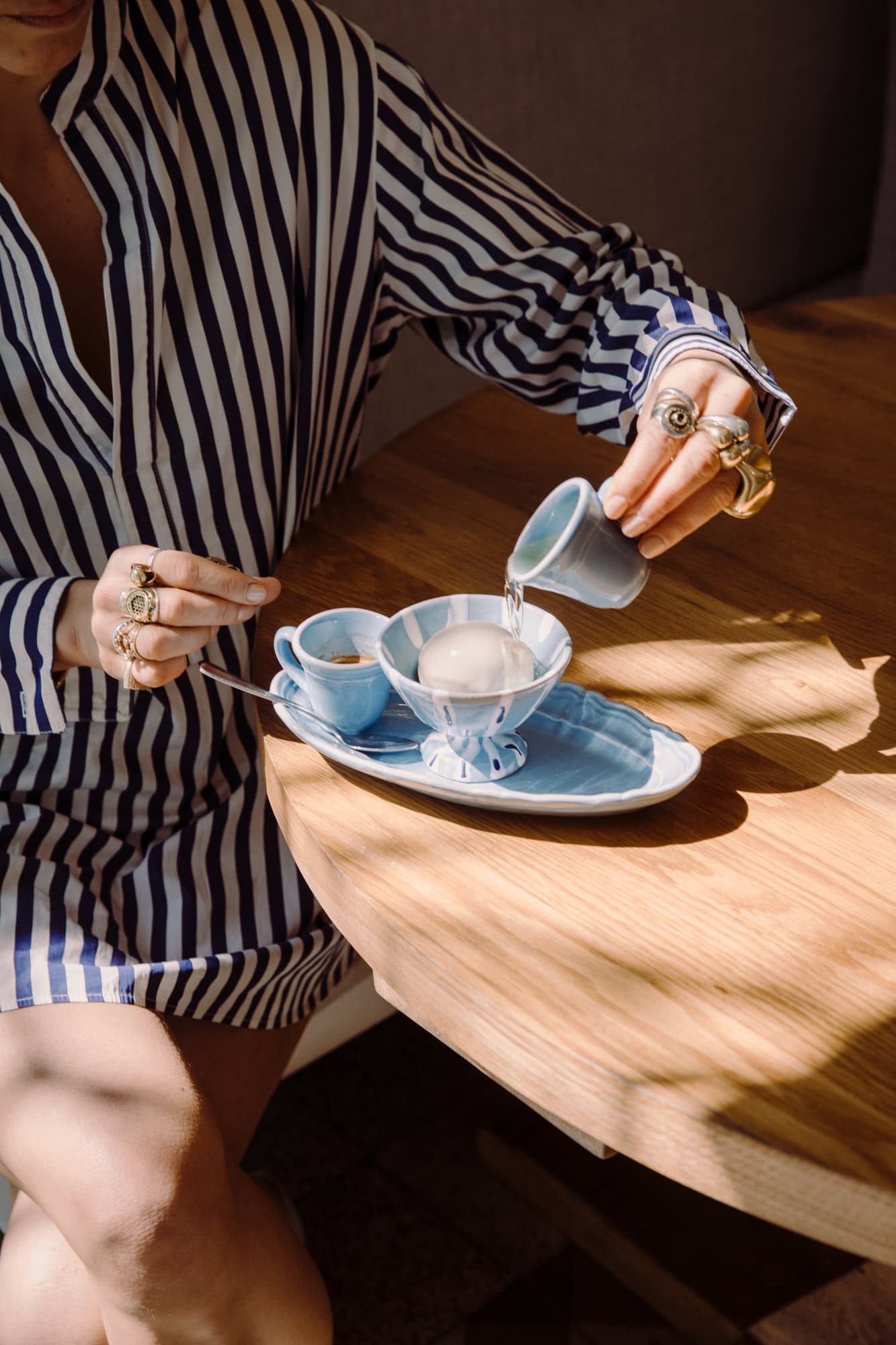 Blue Alex and Trahanas x Raes Vacanza scalloped oval plate, espresso cup and gelato cup on a timber table, Byron Bay