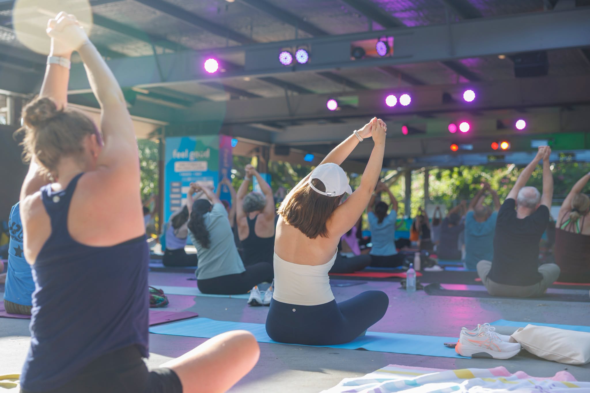 People participating in free outdoor yoga with Feel Good South Bank.