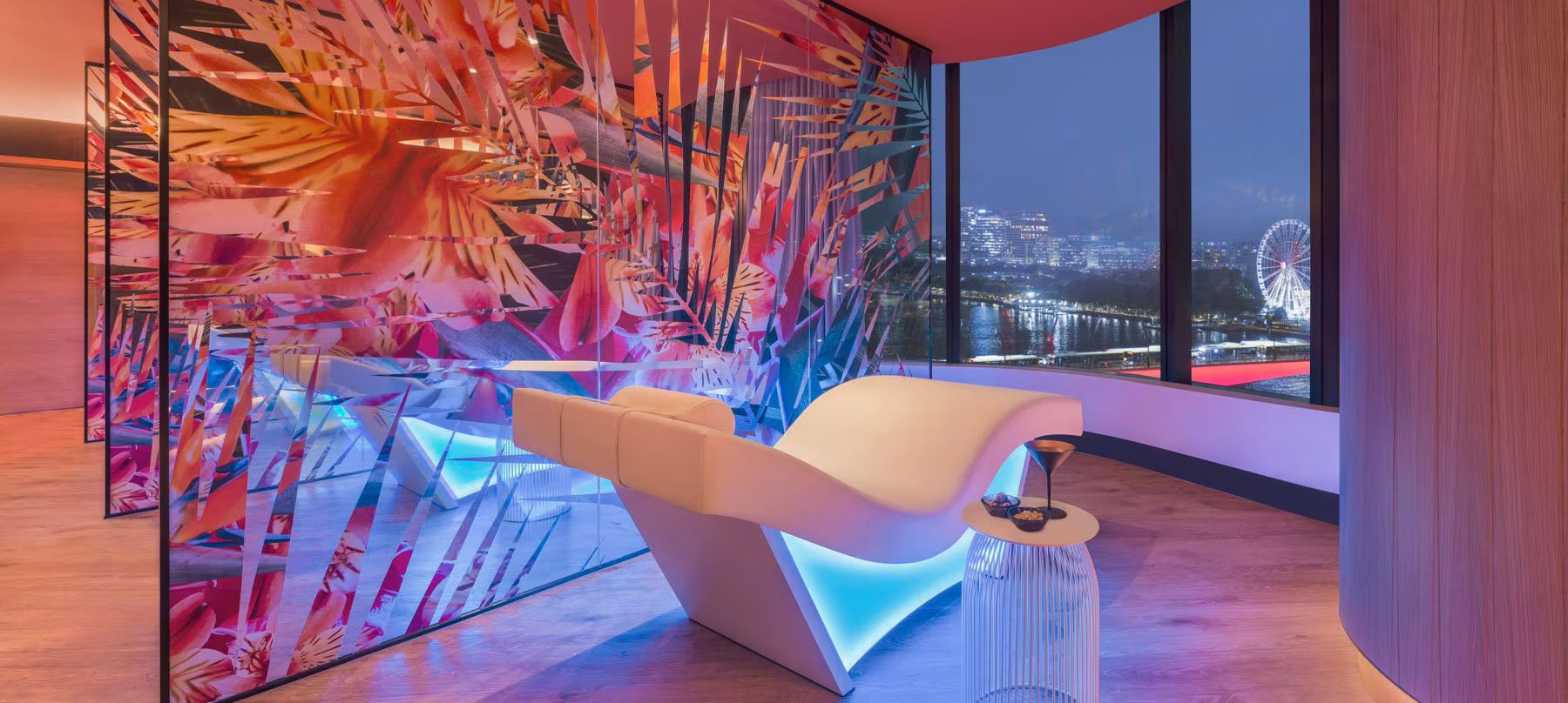 View of a lounge facing a window in a modern, high rise building.