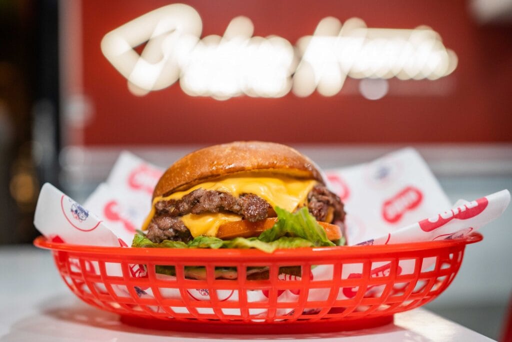 A cheeseburger in a basket from Broken Hearts Burger Club.